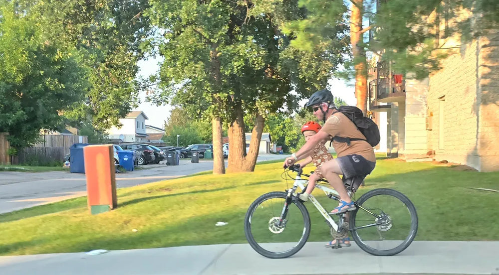 Parent and child riding with a front-mounted seat